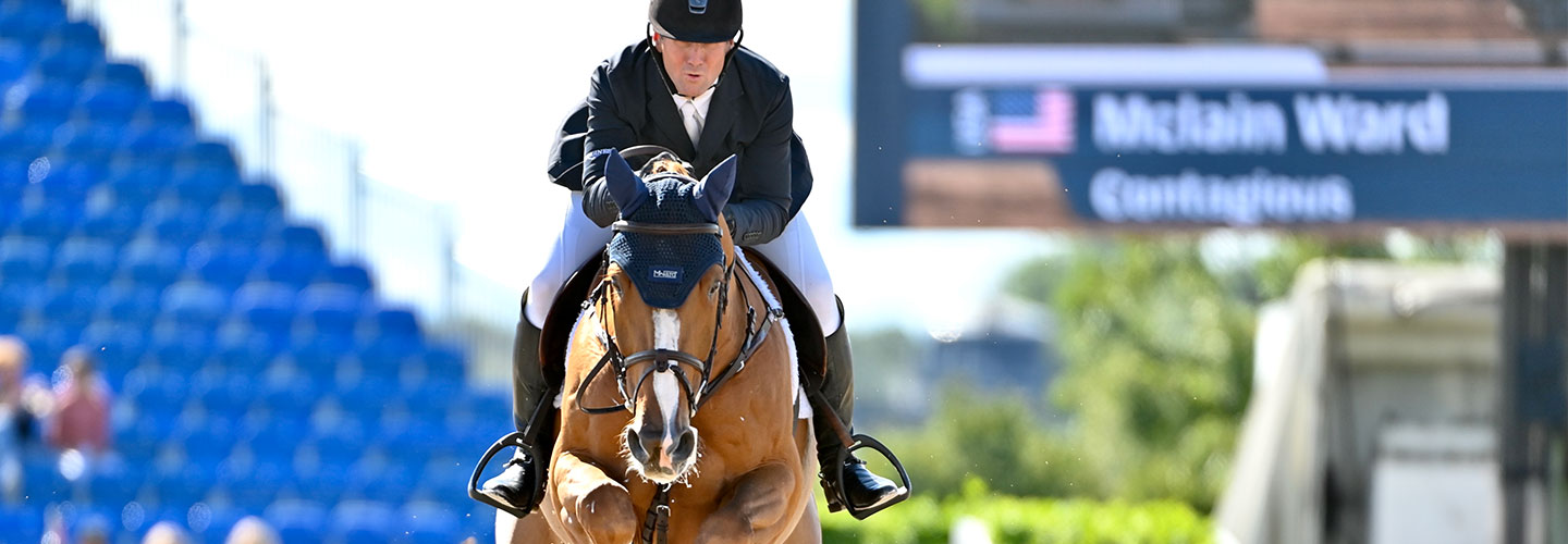 Person riding a horse in competition