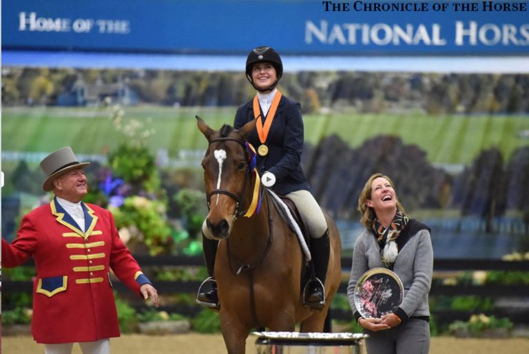 Woman on horse winning award